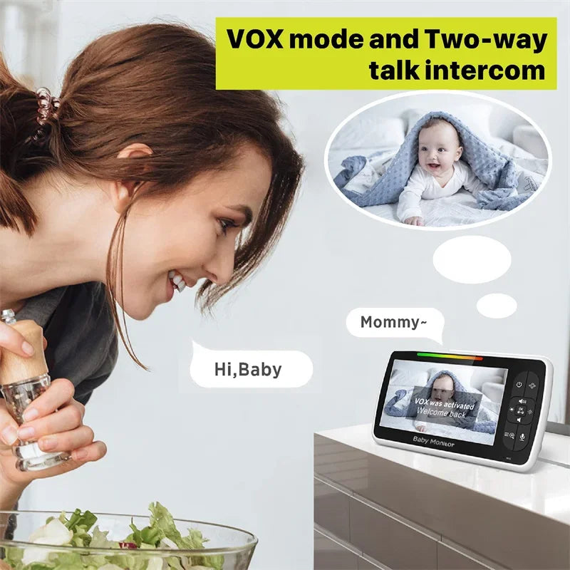 Woman using a baby monitor with VOX mode and two-way talk intercom feature.
