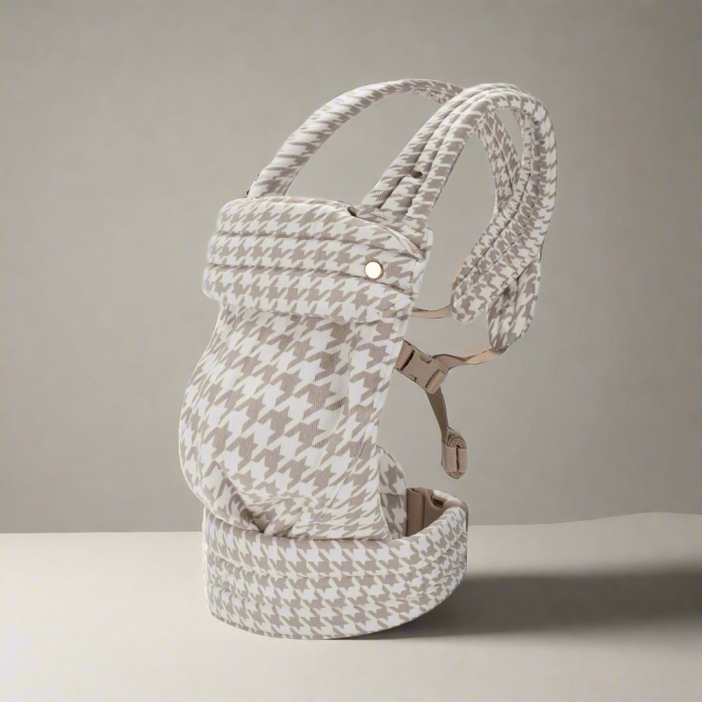 Baby carrier with houndstooth pattern on a white background